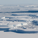Icebergs float between the Larsen C ice shelf and the ice island A-68, as seen by NASA’s Operation IceBridge in October 2018.